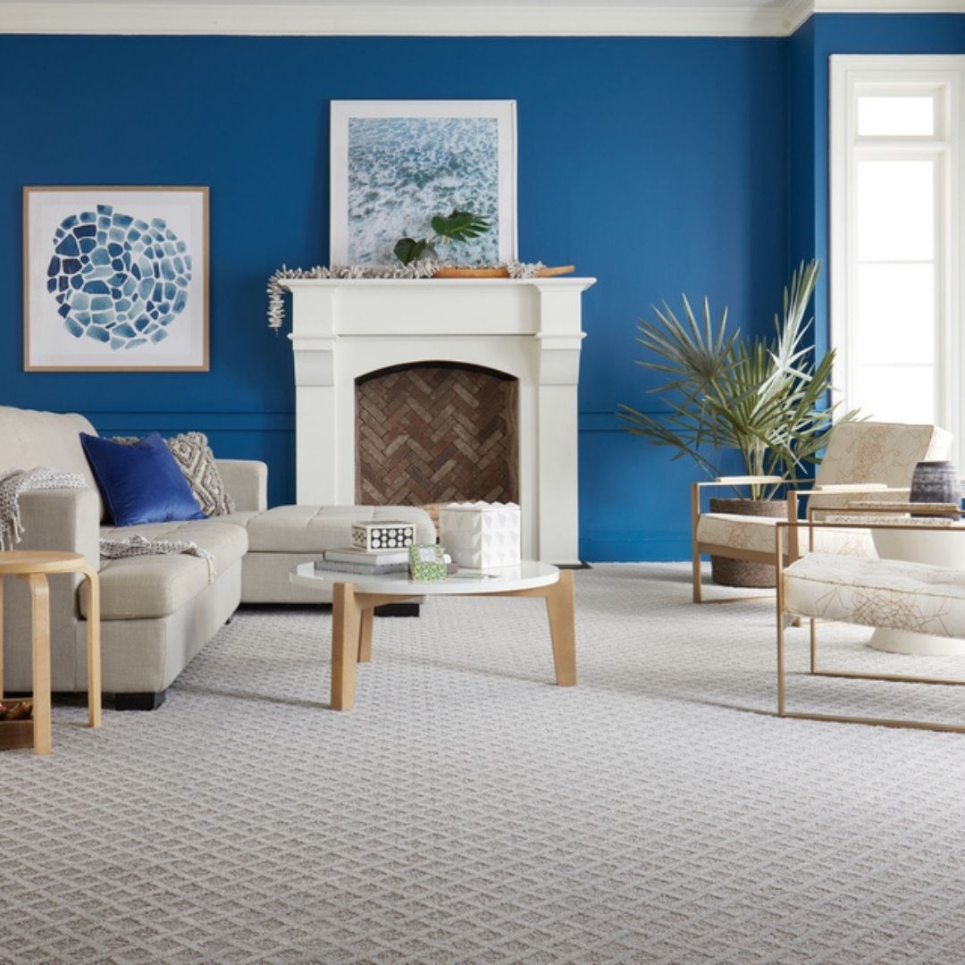 patterned grey carpet in blue living room