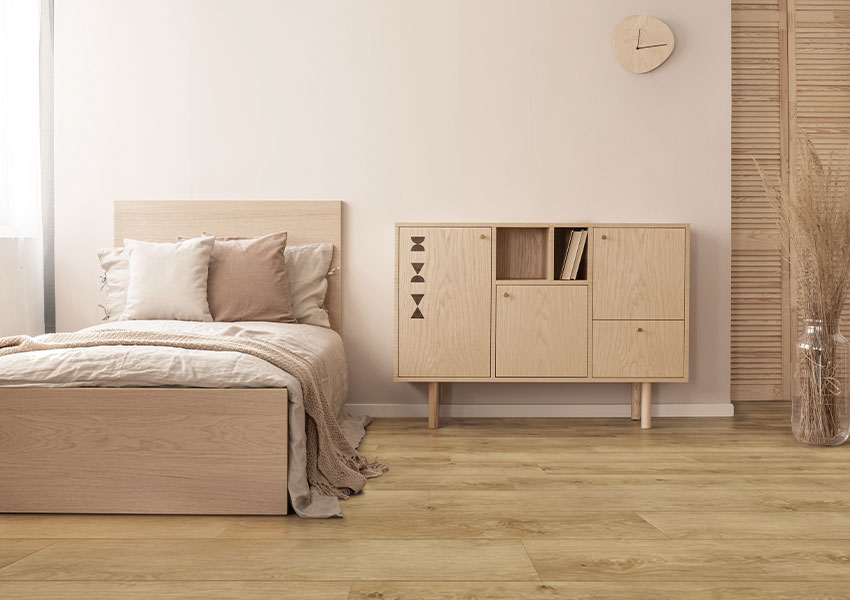 warm toned luxury vinyl plank flooring in bedroom