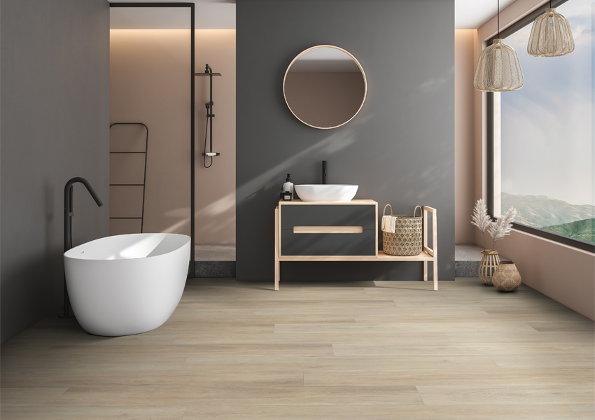 luxury vinyl flooring in bathroom with bathtub and boho decor.